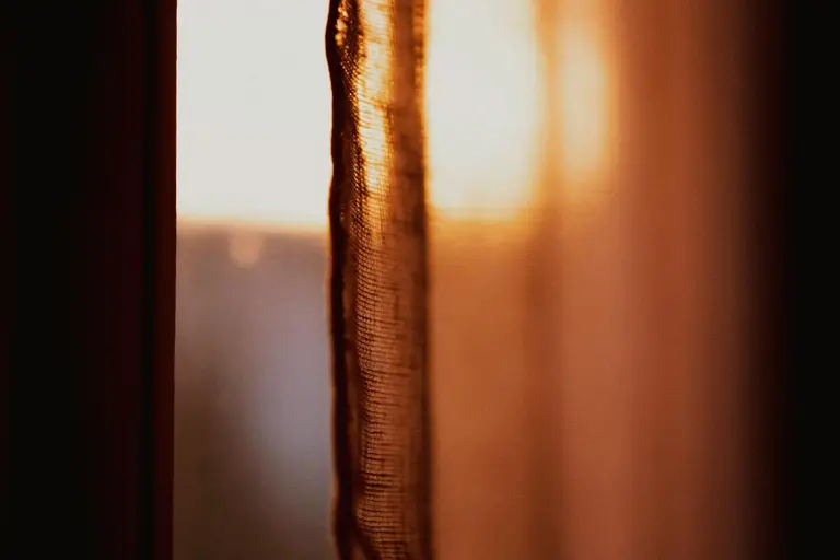 Sunlight reaching through a window onto a kitchen counter
