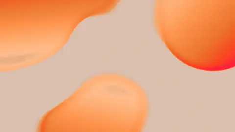 Soft orange abstract droplet shapes on a warm background